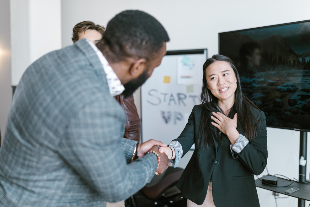 A Man Shaking a Woman's Hand